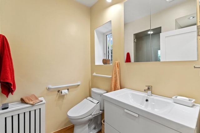 359 Garcia St, Santa Fe, NM 87501 - bathroom featuring vanity, radiator, and wood finished floors