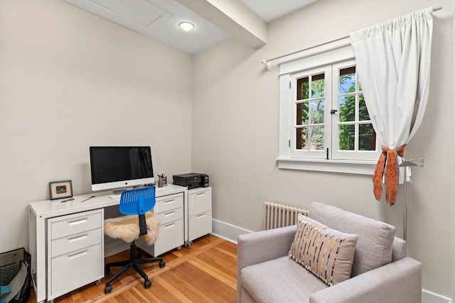 359 Garcia St, Santa Fe, NM 87501 - office area with radiator and light wood-style floors