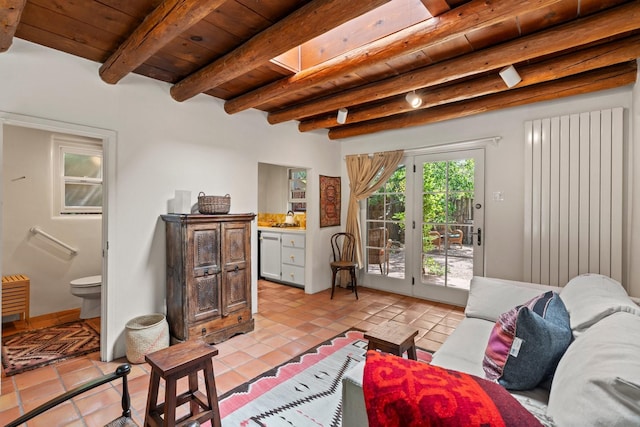 359 Garcia St, Santa Fe, NM 87501 - living room with a wooden ceiling with exposed beams and light tile patterned floors