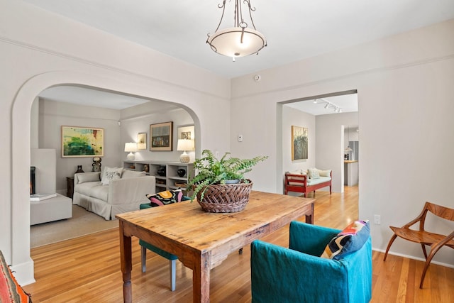 359 Garcia St, Santa Fe, NM 87501 - dining area featuring arched walkways and light wood-style floors