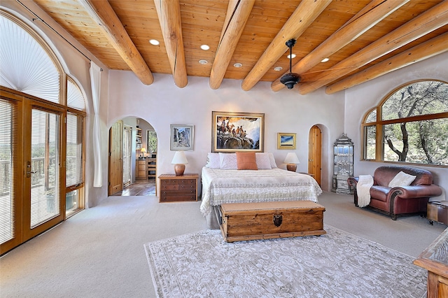 51 Coyote Mountain Rd, Santa Fe, NM 87505 - bedroom featuring arched walkways, carpet, recessed lighting, and a wooden ceiling with exposed beams