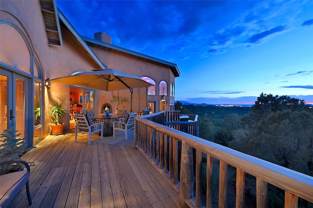 51 Coyote Mountain Rd, Santa Fe, NM 87505 - deck at dusk with outdoor dining area