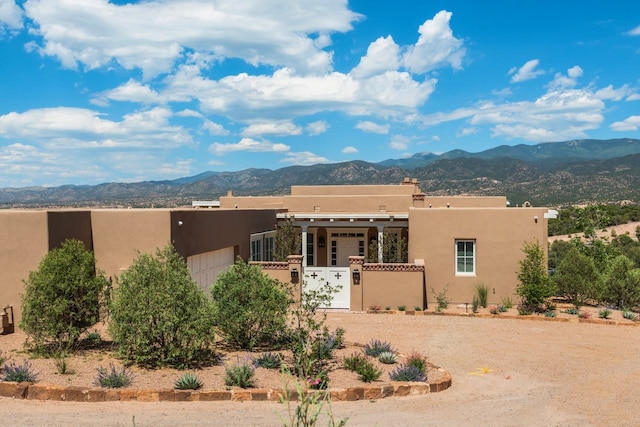 102 San Rafael Dr, Santa Fe, NM 87506 - southwest-style home with a mountain view, a gate, a garage, and stucco siding