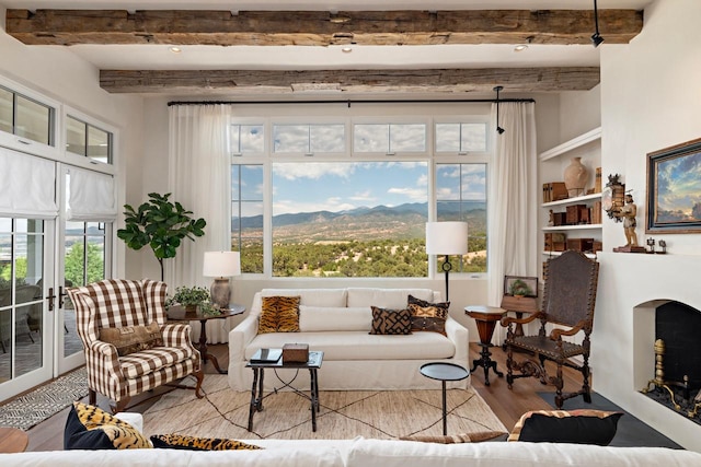 102 San Rafael Dr, Santa Fe, NM 87506 - living area with wood finished floors, beamed ceiling, and a mountain view