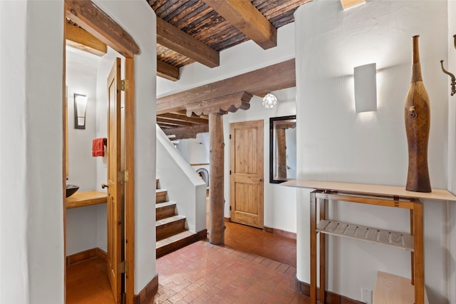 134 W Houghton St Unit D, Santa Fe, NM 87505 - entryway with brick flooring, stairs, and a wooden ceiling with exposed beams