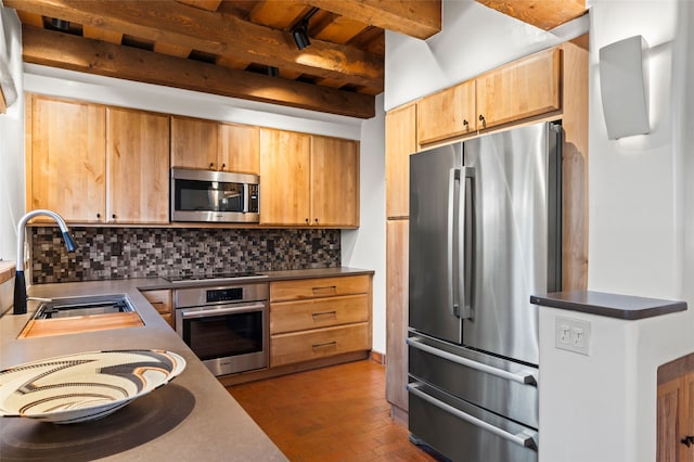 134 W Houghton St Unit D, Santa Fe, NM 87505 - kitchen featuring stainless steel appliances, tasteful backsplash, beam ceiling, and dark countertops