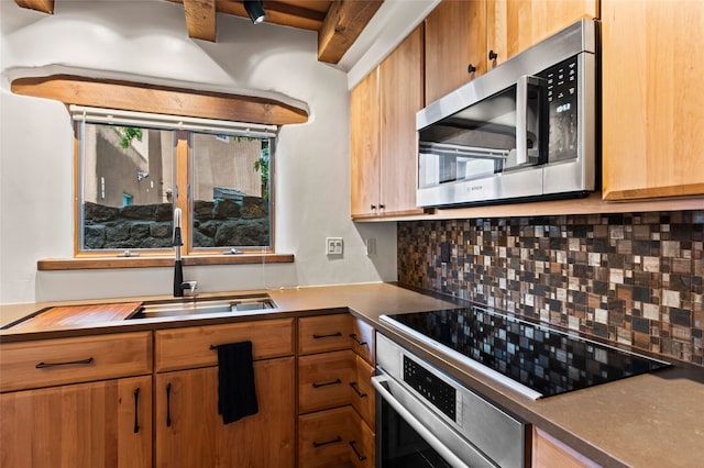 134 W Houghton St Unit D, Santa Fe, NM 87505 - kitchen featuring appliances with stainless steel finishes and tasteful backsplash