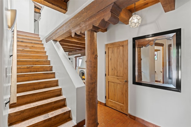 134 W Houghton St Unit D, Santa Fe, NM 87505 - stairway featuring brick flooring and beam ceiling