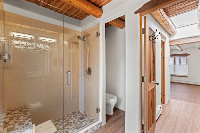 134 W Houghton St Unit D, Santa Fe, NM 87505 - full bathroom featuring wood finished floors, a baseboard heating unit, a stall shower, and beamed ceiling