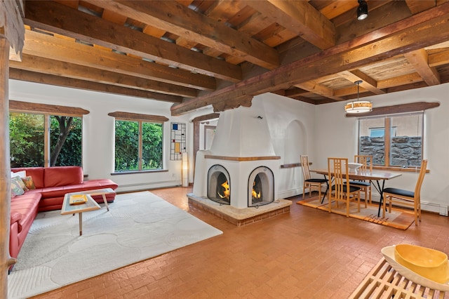 134 W Houghton St Unit D, Santa Fe, NM 87505 - living area with brick patterned flooring, baseboard heating, a fireplace, and a wood ceiling with exposed beams