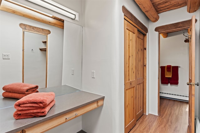 134 W Houghton St Unit D, Santa Fe, NM 87505 - bathroom featuring a baseboard heating unit, wood finished floors, a baseboard radiator, and wood ceiling