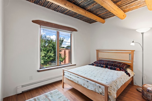 134 W Houghton St Unit D, Santa Fe, NM 87505 - bedroom featuring a baseboard radiator, wood finished floors, and a wooden ceiling with exposed beams