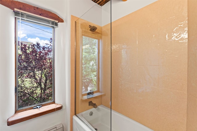 134 W Houghton St Unit D, Santa Fe, NM 87505 - bathroom featuring a baseboard radiator and washtub / shower combination
