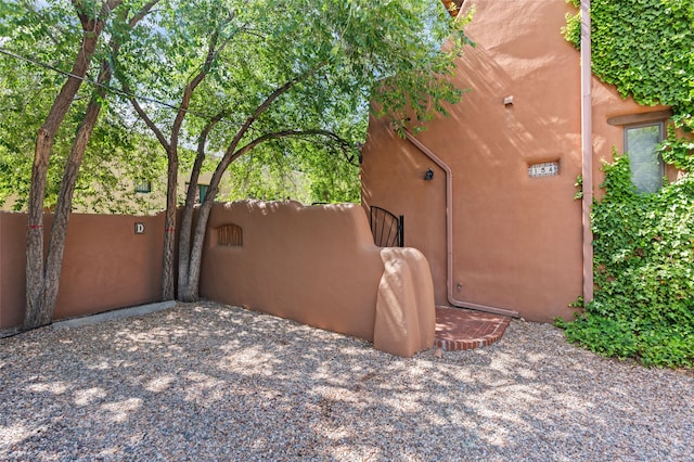 134 W Houghton St Unit D, Santa Fe, NM 87505 - view of home's exterior featuring a gate and stucco siding