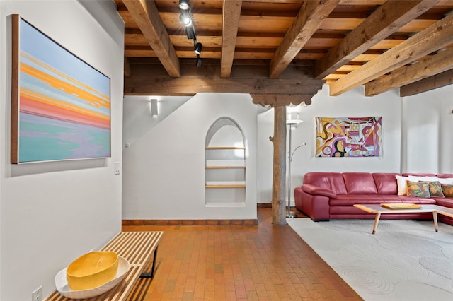 134 W Houghton St Unit D, Santa Fe, NM 87505 - living area with a wooden ceiling with exposed beams and brick floors