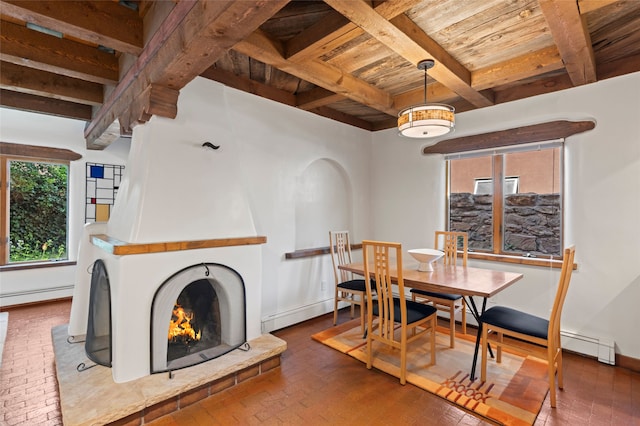 134 W Houghton St Unit D, Santa Fe, NM 87505 - dining space featuring baseboard heating, a wooden ceiling with exposed beams, brick flooring, and a fireplace
