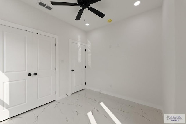 6245 Tiger Dr, Brownsville, TX 78521 - unfurnished bedroom with baseboards, recessed lighting, light marble finish flooring, and ceiling fan