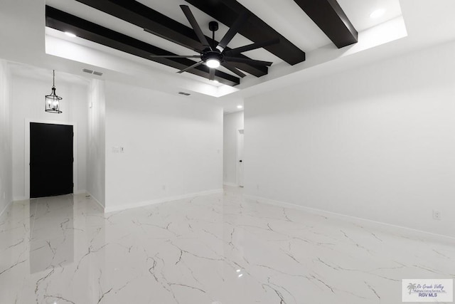 6245 Tiger Dr, Brownsville, TX 78521 - unfurnished room featuring beamed ceiling, baseboards, a ceiling fan, and light marble finish floors