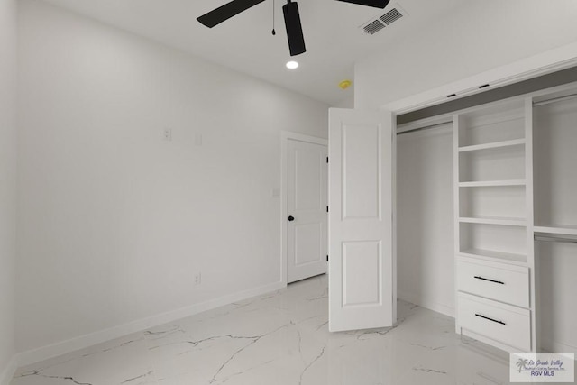 6245 Tiger Dr, Brownsville, TX 78521 - unfurnished bedroom with baseboards, light marble finish flooring, a closet, recessed lighting, and a ceiling fan