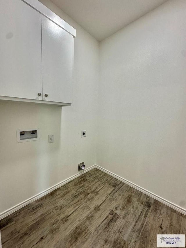 clothes washing area featuring cabinets, hookup for a washing machine, dark wood-type flooring, and hookup for an electric dryer