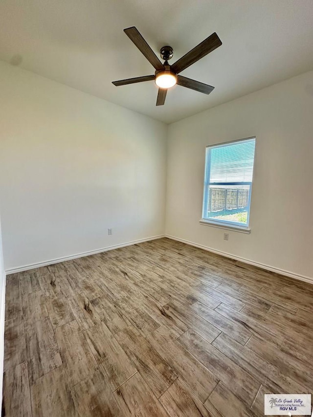 spare room featuring ceiling fan and light wood-type flooring