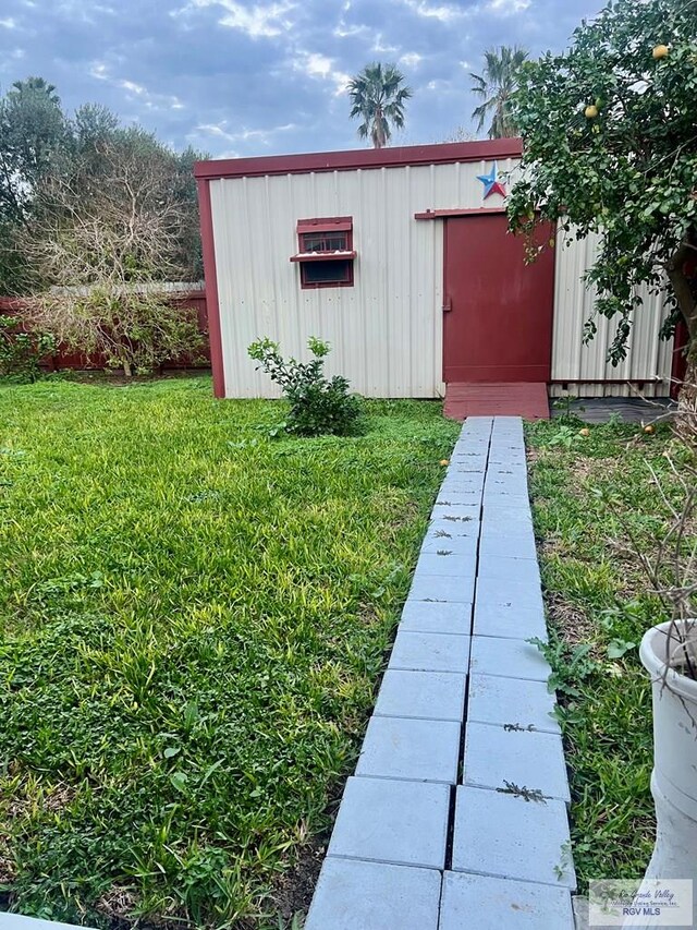 view of outdoor structure with a yard
