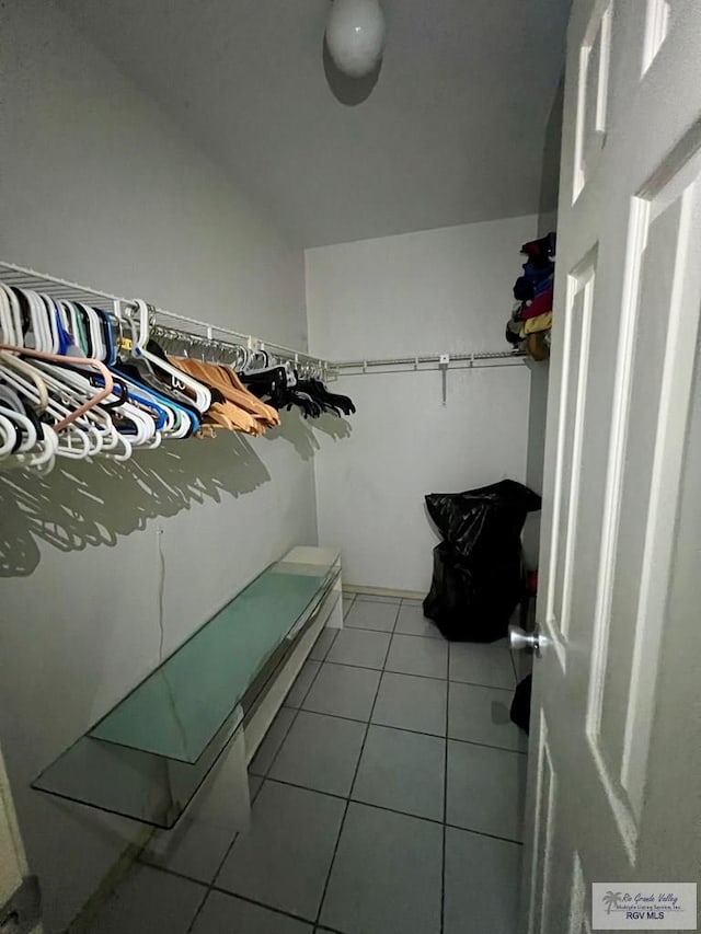 spacious closet featuring light tile patterned flooring