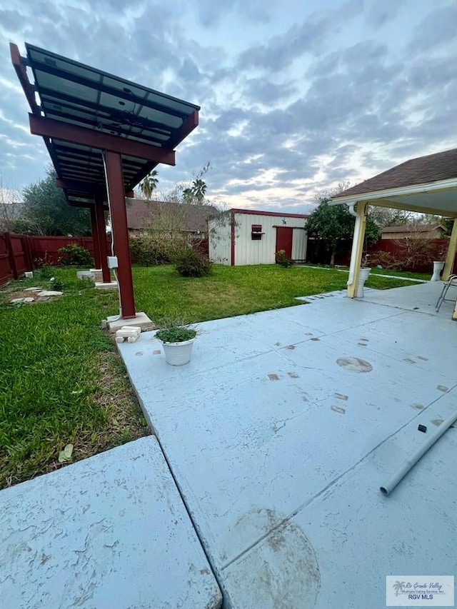view of patio with a storage shed