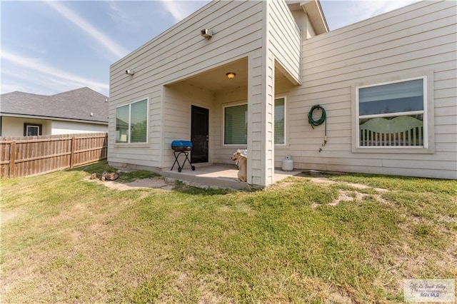 514 Hunt Ave, San Juan, TX 78589 - back of property with a yard, a patio, and fence