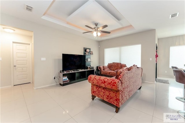 514 Hunt Ave, San Juan, TX 78589 - living room with a ceiling fan, a healthy amount of sunlight, a tray ceiling, and visible vents