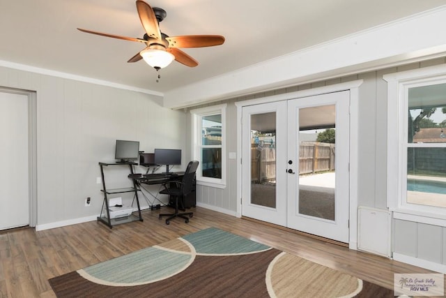 1409 Pine Ct, Harlingen, TX 78550 - home office featuring french doors, wood finished floors, crown molding, ceiling fan, and baseboards