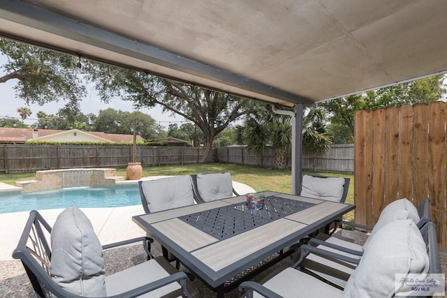 1409 Pine Ct, Harlingen, TX 78550 - view of patio featuring outdoor dining space