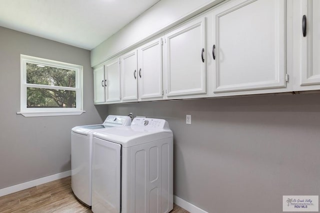 1409 Pine Ct, Harlingen, TX 78550 - laundry area with cabinet space, washing machine and dryer, baseboards, and light wood-style flooring