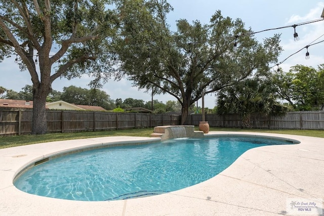 1409 Pine Ct, Harlingen, TX 78550 - view of swimming pool with a fenced backyard and a patio