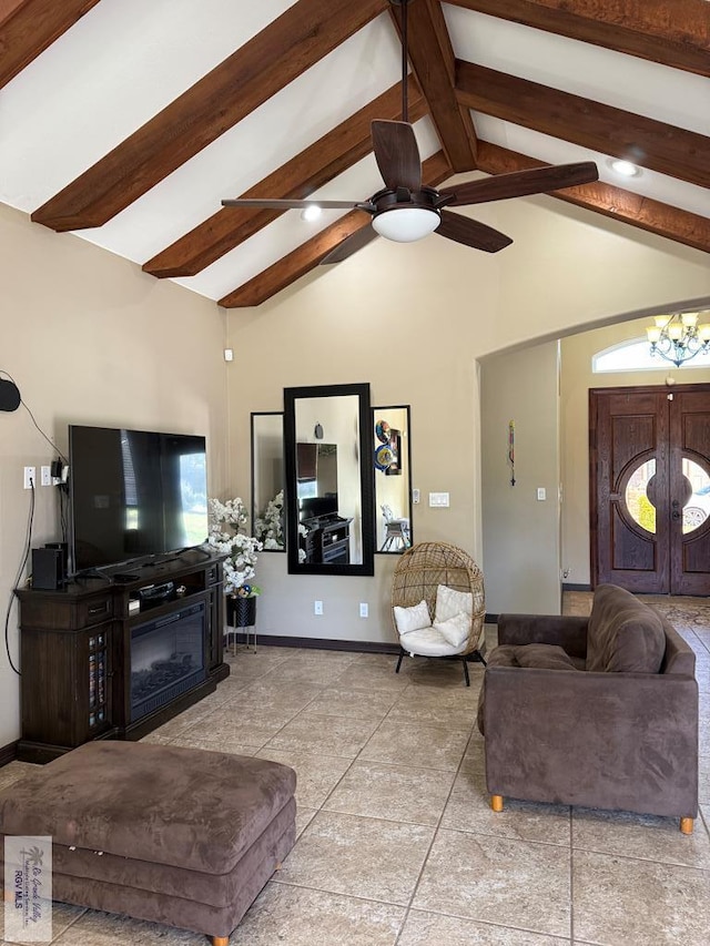 living room with a glass covered fireplace, beam ceiling, baseboards, and high vaulted ceiling