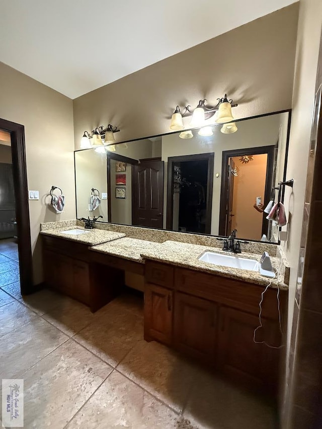 bathroom with double vanity and a sink