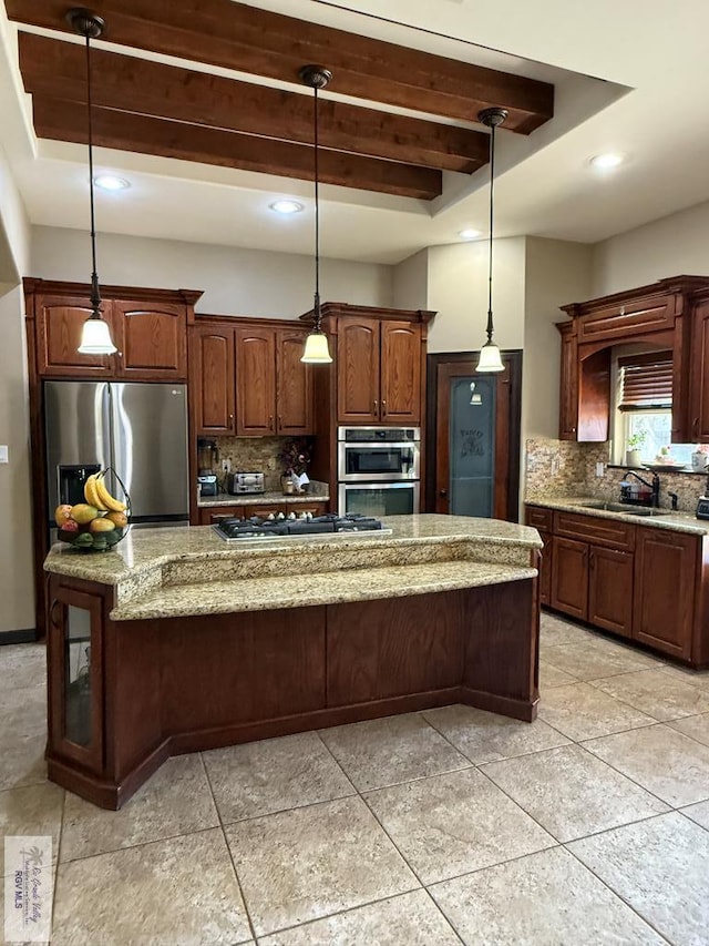 kitchen featuring decorative backsplash, beam ceiling, appliances with stainless steel finishes, and a sink