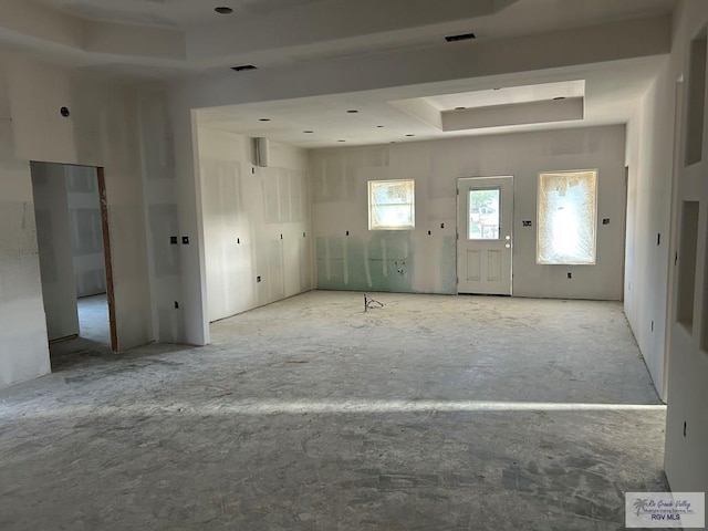 32711 Jorge St, Los Fresnos, TX 78566 - unfurnished living room featuring a raised ceiling