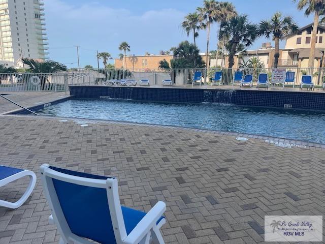 1000 Padre Blvd Unit 307, South Padre Island, TX 78597 - community pool featuring fence and a patio