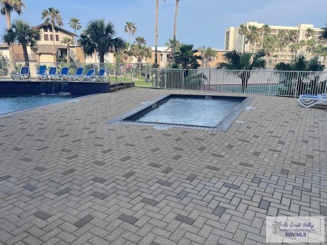 1000 Padre Blvd Unit 307, South Padre Island, TX 78597 - community pool featuring fence and a patio area