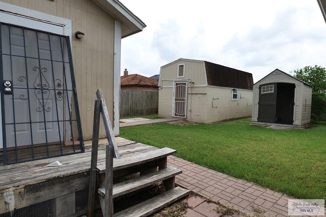 487 Agua Viva Ln, Brownsville, TX 78521 - view of yard featuring a storage unit and an outdoor structure