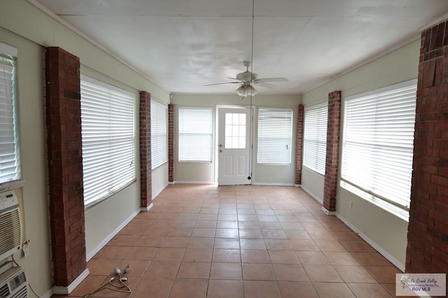 487 Agua Viva Ln, Brownsville, TX 78521 - unfurnished sunroom featuring tile patterned flooring and baseboards