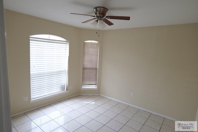 487 Agua Viva Ln, Brownsville, TX 78521 - spare room with a ceiling fan, light tile patterned floors, and baseboards