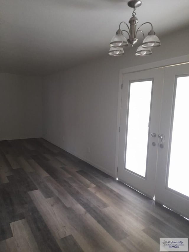 interior space with french doors, dark wood-style flooring, and plenty of natural light