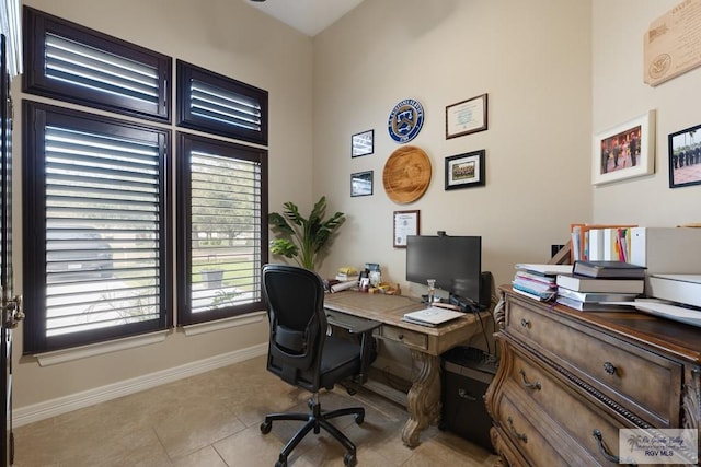 home office featuring light tile patterned flooring