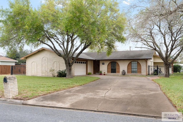 ranch-style home with a garage and a front lawn