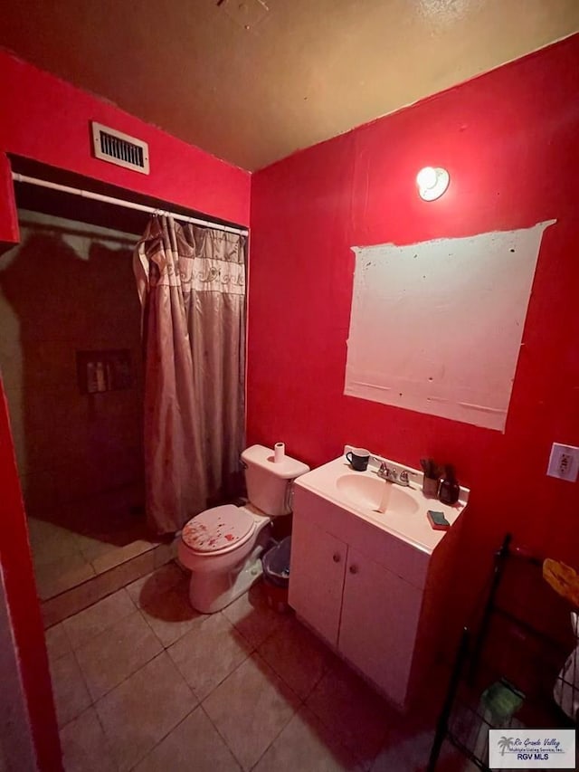 1770 Palmas Verdes Ct, Brownsville, TX 78520 - full bath with tile patterned floors, visible vents, toilet, and a shower with shower curtain