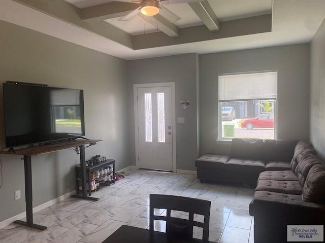 living room with beamed ceiling, marble finish floor, ceiling fan, and baseboards