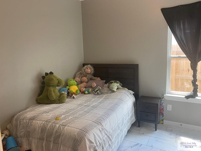 bedroom with marble finish floor