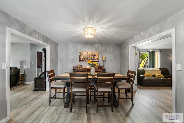 dining space featuring wood finished floors